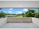 Balcony view showing a lovely neighborhood view under a bright blue sky at 1540 N Lake Mirror Nw Dr, Winter Haven, FL 33881