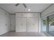 Spacious bedroom with built-in closets and sliding doors to a balcony at 1540 N Lake Mirror Nw Dr, Winter Haven, FL 33881