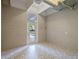 Versatile bonus room with modern tile flooring, bright lighting, and easy access to the outdoors at 1540 N Lake Mirror Nw Dr, Winter Haven, FL 33881