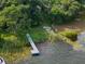 Aerial shot of a dock on the lake providing direct water access with lush vegetation and a serene setting at 1540 N Lake Mirror Nw Dr, Winter Haven, FL 33881