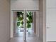 Grand foyer with double doors, offering a bright and inviting view into the home at 1540 N Lake Mirror Nw Dr, Winter Haven, FL 33881