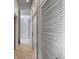 Hallway with sleek design, featuring modern doors, and stylish flooring at 1540 N Lake Mirror Nw Dr, Winter Haven, FL 33881