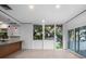 Living area offers serene views through large windows, complemented by sleek countertops and ambient lighting at 1540 N Lake Mirror Nw Dr, Winter Haven, FL 33881