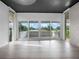 Living room with sliding glass doors to balcony at 1540 N Lake Mirror Nw Dr, Winter Haven, FL 33881