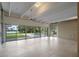 Expansive living room with tile flooring, perfect for entertaining or relaxing with lake and pool views at 1540 N Lake Mirror Nw Dr, Winter Haven, FL 33881