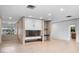 Open living room with fireplace and tile flooring is bright and airy at 1540 N Lake Mirror Nw Dr, Winter Haven, FL 33881