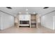 Spacious living room featuring a fireplace and tile flooring at 1540 N Lake Mirror Nw Dr, Winter Haven, FL 33881