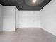 Living room with built-in white cabinets and tile floors at 1540 N Lake Mirror Nw Dr, Winter Haven, FL 33881