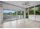 Bright sun room with tiled floors and large windows offering outdoor views at 1540 N Lake Mirror Nw Dr, Winter Haven, FL 33881