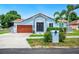 Beautiful single-story home with a well-maintained lawn and mature landscaping at 1553 Wright Dr, Lakeland, FL 33805