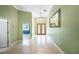 Elegant entryway with tile floors, chandelier, and decorative wood front doors at 1553 Wright Dr, Lakeland, FL 33805