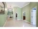 Bright foyer with tile flooring, chandelier lighting, and neutral paint at 1553 Wright Dr, Lakeland, FL 33805