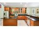 Spacious kitchen with wood cabinetry, granite countertops, and stainless steel appliances at 1553 Wright Dr, Lakeland, FL 33805