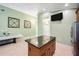 Kitchen island featuring granite countertops, wood cabinets, and pendant lighting at 1553 Wright Dr, Lakeland, FL 33805