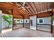 Outdoor wooden patio and ceiling fan provides a refreshing and relaxing ambiance. Seamless indoor/outdoor flow at 1553 Wright Dr, Lakeland, FL 33805