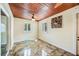 Bright sun room with tile floor, wood ceiling, windows, and modern decor at 1553 Wright Dr, Lakeland, FL 33805