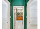 Open doorways reveal large walk-in closets and a luxurious bathroom with dual sinks and granite counters at 1553 Wright Dr, Lakeland, FL 33805
