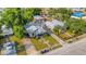 Aerial view showcasing the property's layout, including the detached garage, and its neighborhood setting at 165 E Pierce St, Lake Alfred, FL 33850