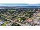 Aerial view showcases the property's location near a lake and residential area at 165 E Pierce St, Lake Alfred, FL 33850