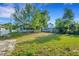 A spacious backyard provides ample room for outdoor activities and relaxation at 165 E Pierce St, Lake Alfred, FL 33850