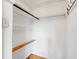 Walk-in closet with built-in shelves and hanging rod at 165 E Pierce St, Lake Alfred, FL 33850