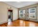 Charming dining room featuring hardwood floors and many windows letting in natural light at 165 E Pierce St, Lake Alfred, FL 33850