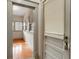 Hallway featuring natural light and an entrance door with vintage door knob at 165 E Pierce St, Lake Alfred, FL 33850
