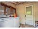 Laundry area featuring washer, dryer and door leading to the backyard at 165 E Pierce St, Lake Alfred, FL 33850