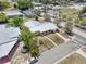 Aerial view of a quaint home with mature trees, on a corner lot at 1929 4Th Ne St, Winter Haven, FL 33881