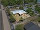 Aerial view showcasing the property's layout, surrounding greenery, and convenient location within a residential neighborhood at 1929 4Th Ne St, Winter Haven, FL 33881