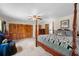 Bedroom features a four-poster bed, a wall of closets, and a ceiling fan at 1929 4Th Ne St, Winter Haven, FL 33881