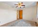 Bedroom with neutral carpet and paint and with ceiling fan at 1929 4Th Ne St, Winter Haven, FL 33881