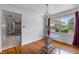 Cozy dining area with hardwood floors, chandelier, and seamless access to the adjacent kitchen at 1929 4Th Ne St, Winter Haven, FL 33881