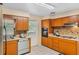 Functional kitchen with ample cabinet space, tile flooring, and modern appliances at 1929 4Th Ne St, Winter Haven, FL 33881