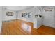 Bright living room featuring hardwood floors, fresh white paint, and vintage decorative elements at 1929 4Th Ne St, Winter Haven, FL 33881
