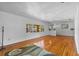 Spacious living room with hardwood floors and natural light streaming through large windows at 1929 4Th Ne St, Winter Haven, FL 33881