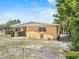Cozy backyard featuring a partially covered patio and simple landscaping providing a tranquil outdoor space at 1929 4Th Ne St, Winter Haven, FL 33881