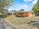 Home with a large backyard and partially covered patio, perfect for outdoor enjoyment and entertaining guests at 1929 4Th Ne St, Winter Haven, FL 33881