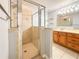 Bathroom featuring a glass shower, a vanity with sink, and a mirror at 2018 Misty Morning Dr, Winter Haven, FL 33880