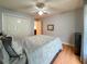 Bedroom featuring hardwood floors, a ceiling fan, and closet space at 2018 Misty Morning Dr, Winter Haven, FL 33880