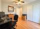 Bedroom with wood flooring, a ceiling fan, and plenty of storage space at 2018 Misty Morning Dr, Winter Haven, FL 33880