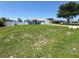 Inviting single-Gathering home with a green lawn, blue siding, white trim, and a welcoming facade on a sunny day at 2018 Misty Morning Dr, Winter Haven, FL 33880