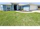 Charming home featuring a manicured lawn, tasteful landscaping, and a welcoming front entrance for immediate curb appeal at 2018 Misty Morning Dr, Winter Haven, FL 33880