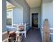 Inviting front porch featuring decor, providing a welcoming entry with plants and tasteful design enhancing curb appeal at 2018 Misty Morning Dr, Winter Haven, FL 33880