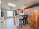 Open kitchen with breakfast bar, stainless steel appliances, and natural light at 2018 Misty Morning Dr, Winter Haven, FL 33880