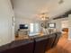 Spacious living room with vaulted ceiling, ceiling fan and access to the dining room at 2018 Misty Morning Dr, Winter Haven, FL 33880