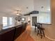 Spacious living area featuring hardwood floors, vaulted ceilings, and an open concept layout with natural lighting and neutral decor at 2018 Misty Morning Dr, Winter Haven, FL 33880