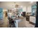 Bright kitchen features granite countertops, white cabinets, stainless appliances, and a kitchen island at 2213 W Pilaklakaha Ave, Auburndale, FL 33823