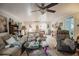 Inviting living room with tongue and groove ceilings, ceiling fan, and comfortable seating at 2213 W Pilaklakaha Ave, Auburndale, FL 33823