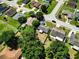 Overhead view of a house, showcasing its backyard, landscaping, and surrounding neighborhood at 2240 Country Manor St, Bartow, FL 33830